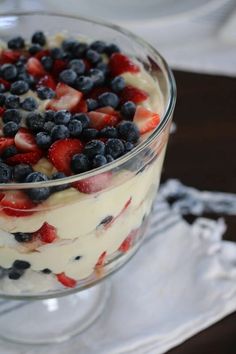 a trifle with strawberries and blueberries in it