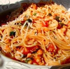 pasta with tomato sauce and parmesan cheese in a bowl