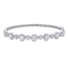 A stunning piece with no shortage of sparkle, this bangle features 3.00 carats of round brilliant cut diamonds alternating in small and large halos. Diamonds Direct, Diamond Bracelets, Diamond Halo, Round Brilliant Cut Diamond, Halo Diamond, Bangle Bracelet, Round Brilliant, Womens Jewelry Bracelets, Bangle Bracelets