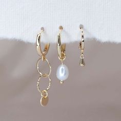 Product Description Discover the charming features and elegance of our Dainty pearl earrings, which are designed to add a touch of sophistication to any outfit. These exquisitely made freshwater pearl earrings, delicately plated in 14K yellow gold, exude delicate elegance and timeless charm. They are hypoallergenic and lightweight, and their thoughtful construction ensures comfort even after prolonged use. Because of their strong backings, you can wear them with assurance for any kind of occasio Dainty Gold-plated Pearl Earrings For Pierced Ears, Dainty Gold Plated Pearl Earrings, Delicate Gold Pearl Single Earring, Dainty Gold Dangle Pearl Earrings, Delicate Gold-plated Pearl Earrings For Pierced Ears, Delicate Gold-plated Pearl Earrings, Everyday Gold Plated Pearl Pendant Earrings, Minimalist Gold-plated Earrings With Pearl Pendant, Minimalist Gold Plated Earrings With Pearl Pendant