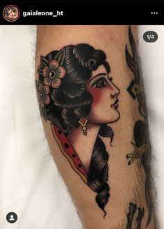 a woman's leg with tattoos on it