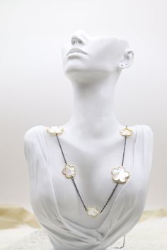 The Mother of Pearl Five Leaf Flower Petal Pendant Necklace displays a radiant pendant crafted with five mother of pearl inlaid petals, forming an elegant flower design. This necklace, set on a simple chain, offers a touch of refined beauty that perfectly complements both everyday and formal attire. Length: 36 inches Clover: 26.0 mm and 18.8 mm Closure: Lobster Claw Material: Brass with 18K Gold Plating and Rhodium Coating Lead Free and Hypoallergenic Necklace Displays, Simple Chain, Leaf Flower, Clover Necklace, Flower Petal, Elegant Flowers, Leaf Flowers, Formal Attire, Flower Petals