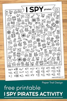 the printable i spy pirate activity is shown on a wooden table with text that reads,