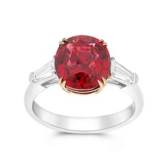 This three-stone style ring features a trio of glistening diamonds - the largest being an oval red spinel center stone set in a rose gold double cat claw setting with two trillion diamonds on either side. Surprise your loved one with this exclusive, hand-crafted dazzling piece. Available in all sizes. Send us yours! Luxury Oval Three-stone Ruby Ring, Luxury Red Three Stone Jewelry, Luxury Red Three-stone Jewelry, Luxury Ruby Three Stone Rings, Oval Red Ruby Ring With Three Stones, Fine Jewelry Red Diamond Three Stone Ring, Elegant Three Stone Red Diamond Ring, Elegant Three-stone Red Diamond Ring, Elegant Red Three-stone Diamond Ring