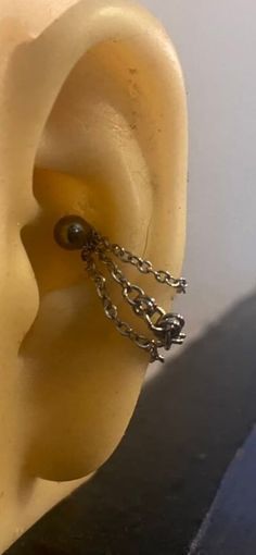 an ear with chain attached to it