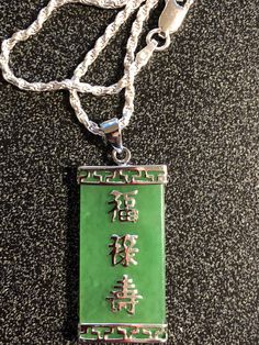 Beautiful Green Rectangular shape 1.18 x 0.625 inch Jade Sterling Silver Chinese Characters and Bezel with 20 in 2MM Sterling Sliver Diamond Cut Rope Chain from our personal collection of vintage jewelry Free priority Maill 2-3 Day shipping Green Rectangular Sterling Silver Jewelry, Formal Jewelry With Adjustable Chain And Rectangular Shape, Formal Rectangular Chain Jewelry, Rectangular Silver Jewelry, Formal Rectangular Jade Jewelry, Rectangular Sterling Silver Chain Jewelry, Engraved Silver Rectangular Jewelry, Chinese Characters, Rope Chain