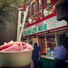 an ice cream sundae sits in front of a store