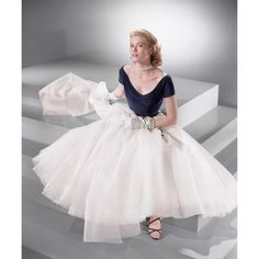 Grace Kelly: Classic Portrait of Elegance  This elegant full-length studio portrait features the "Princess of Grace", Grace Kelly. This image captures the star in a tulle skirt, sitting on steps inside of a photo studio. Grace Patricia Kelly was born on November 12, 1929. She was an American film actress who, after starring in several significant films in the early to mid-1950s, became Princess of Monaco by marrying Prince Rainier III in April 1956. Kelly retired from acting at the age of 26 to Black Tie Party Dress, Grace Kelly Dresses, Grace Kelly Style, Princess Grace Kelly, Hollywood Wedding, Hollywood Party, Princess Grace, Monica Bellucci, Vestidos Vintage