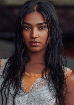 a close up of a person with long hair