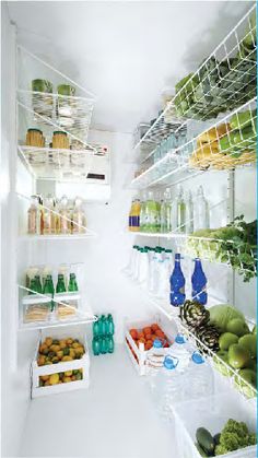 an open refrigerator filled with lots of fresh fruits and veggies on shelves next to each other