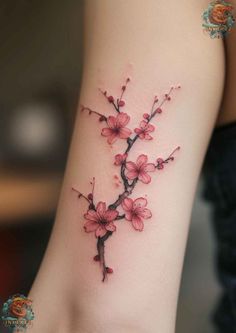 a woman's arm with pink flowers on it