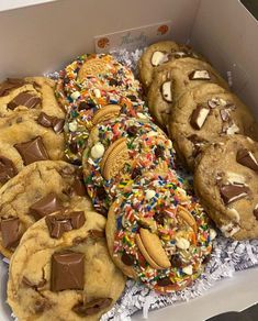 a box filled with lots of cookies and sprinkles