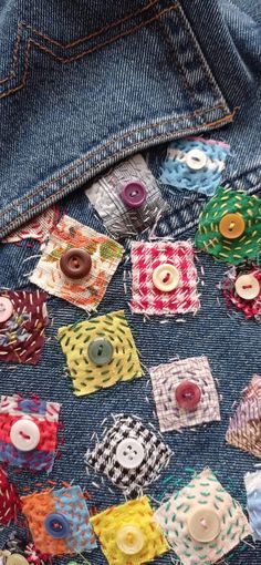 buttons are placed in the back pocket of a jean jacket