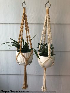 two hanging planters with plants in them