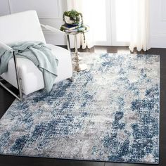 a blue and white rug in a living room