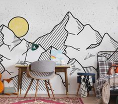 a living room with mountains painted on the wall