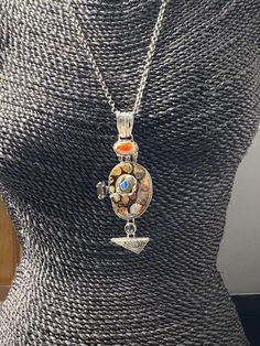 "Long Artisan Fossil with opals pendant Hand-made Sterling Silver 925. Stones used: Ammonite-fossil, Mexican Fire Opal, Pearl, Mystic Topaz, Fossil Coral, Australian Opal Height - 4\" (with bail), Width - 1 5/8\" Height -100mm (with bail), Width - 42mm Unique Handcrafted One-of a-kind Design Pendant Each Piece of Jewelry in my Collection is Absolutely One of a Kind! When you start wearing a piece of my jewelry you will fall in love with it more and more each day and feel that good Energy and Lov Statement Rings Unique, Fossil Ring, Unisex Earrings, Mexican Fire Opal, Ammonite Fossil, Artisan Rings, Witch Jewelry, Fossil Coral, Mystic Topaz