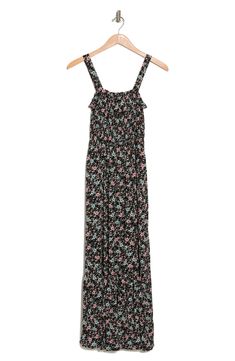 A sleeveless tiered maxi dress with an allover print. 52" length (size M) Square neck Sleeveless 100% rayon Machine wash Line dry Imported Model stats: 5'10" height, 32" bust, 25" waist, 36" hip. Model is wearing size M. Flowy Sleeveless Maxi Dress With Ditsy Floral Print, Sundress With Ditsy Floral Print Maxi Length, Black Sleeveless Rayon Maxi Dress, Black Rayon Maxi Dress For Spring, Casual Flowy Maxi Dress With Adjustable Straps, Sleeveless Ditsy Floral Maxi Dress For Summer, Black Sleeveless Maxi Dress With Smocked Back, Ditsy Floral Print Maxi Sundress, Casual Maxi Dress With Ditsy Floral Print