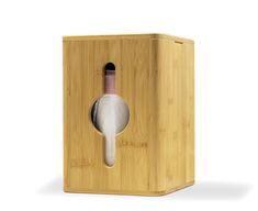 a wooden box with a wine bottle in it and a corkscrew sticking out of the top