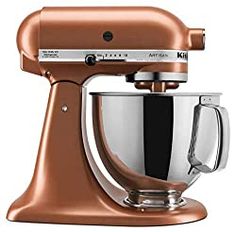 an orange kitchen mixer on a white background