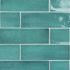 a close up view of a blue tile wall