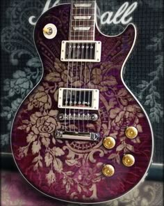 a purple guitar with gold hardware on it's neck and the words hale written in large letters