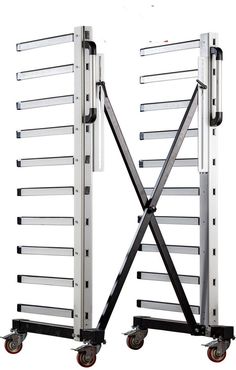 two large metal racks with wheels attached to them