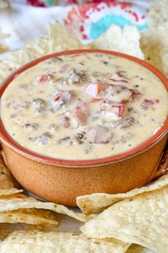 a bowl of soup with tortilla chips on the side