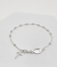 Catholic Sterling Silver Rosary Beads Cross Bracelet. This rosary has a decade of beads and a dangling cross charm. Sterling silver 925 ROSARY BRACELET with Cross and Virgin Mary Oval Medal, Prayer Beads, Catholic Jewelry, Medjugorje, Gift for her size of beads:2mm bracelet length: 19 cm (7,5") Check out our other items in Boutique Medjugorje store: https://boutiquemedjugorje.etsy.com Sterling Silver Rosary Bracelet Gift, Sterling Silver Rosary Bracelet With Round Beads, Sterling Silver Rosary Bracelet With Round Beads As Gift, Sterling Silver Rosary Bracelet With Silver Beads, Silver Rosary Bracelet With Silver Beads, Silver Rosary Bracelet For Jewelry Making, Silver Rosary Bracelet With 8mm Beads As Gift, Spiritual Sterling Silver Rosary Bracelet With Silver Beads, Spiritual Round Rosary Bracelet With Polished Beads