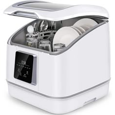 a white dishwasher with dishes in it's center and the lid open