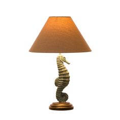 a lamp with a sea horse on it