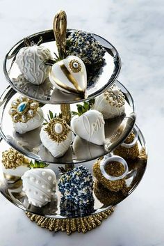 three tiered trays filled with different types of candies