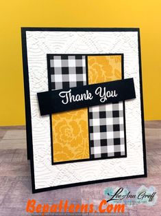 a thank card with the words thank you in black, white and yellow plaid fabric