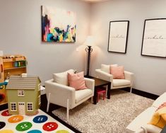 a living room with two chairs and a rug in front of the couches on the floor