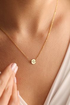 "Custom letter necklaces are perfect for all outfits. It is so dainty and chic with heart symbol. Here you will find the super elegant initial necklace with us. You may design your personalized jewelry necklace with any letter with a small heart just next to your/her letter. It has 3 different color so one is silver, one is gold and the other one is rose gold. It will look so nice on any women. We think that it is great gift idea for any women or mom.  The gold letter necklace is a durable solid necklace. First quality materials are used while producing our letter necklaces.  Our chains are produced by hand with a special system. It has a solid form. All our jewelry is %100 custom made by hand with Love and Care in our workshop! Nickel Free High Quality Materials Standard Deliver in 8-20 B Simple Personalized Charm Necklace As Gift For Her, Simple Initial Pendant Charm Necklaces, Simple Initial Pendant Charm Necklace For Gift, Simple Round Pendant Initial Necklace As Gift, Simple Initial Pendant Necklace As Gift, Simple Initial Pendant Necklace, Minimalist Initial Pendant Necklace As Gift For Her, Minimalist Personalized Initial Necklace For Her, Personalized Minimalist Initial Necklace For Her