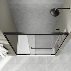 an overhead view of a bathroom with a glass shower door