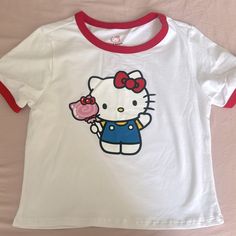 Hello Kitty White Tee Brand New Size - Small White Y2k Cat Print Top, Y2k White Cat Print Top, White Y2k Style Cat Print Top, Cute White Tops With Cat Design, Hello Kitty Baby Tee, Cute White Top With Character Print, Fun Cotton Tops With Hello Kitty, Cute White Tops With Character Print, Cotton Hello Kitty Fun Tops