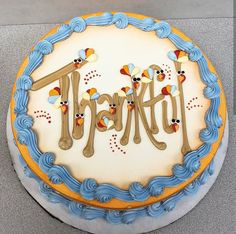 a birthday cake with the word trakty spelled out in frosting on top