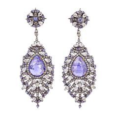 Pretty in Tanzanite White Sapphire & Diamond Dangle Earring is one of the gorgeous piece you would have in your jewelry collection. Closure: Push Post 18kt: 1.94gms Diamond: 2.31cts Slv: 18.7gms White Sapphire: 7.73cts TANZANITE: 15.76cts Tanzanite Diamond Earrings, Purple Dangle Earrings, Emerald Diamond Earrings, Premium Jewelry, Tanzanite Earrings, Tanzanite Diamond, Diamond Dangle Earrings, 18k Gold Jewelry, Gold Earrings Dangle