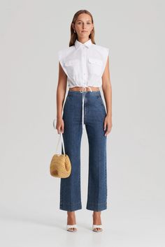 Crafted to lengthen the leg, the Denim Cropped Jean embraces a flattering fit. Featuring a flared hem, functional side and back pockets, and concealed zip fastening with hidden-button closure. Complete your casual ensemble with our Mercerised T-shirt for the perfect statement. Cropped Denim Workwear Bottoms, Cropped Bottoms With Five Pockets, Dark Wash Cropped Leg Flare Jeans, Cropped Denim Pants With Frayed Hem, Cropped Five-pocket Pants For Work, Cropped Work Pants With Five Pockets, Cropped Workwear Pants With Five Pockets, Fitted Cropped Bottoms With Frayed Hem, Spring Denim Bottoms With Cropped Hem