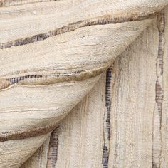 close up view of the fabric textured with natural dyes and lines on linen material