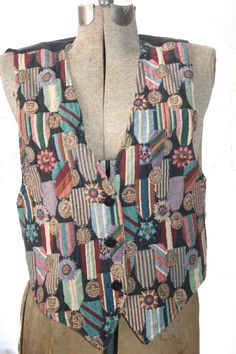 "size: small Vintage from 1990s Maker: Facets by Mirrors Vintage boho vest. Has beautiful abstract designs. Very vivid colors. Colors are mint green, red, blue , brown, beige, dark green, pink, purple. Has 3 buttons. Has tie on back. Style: bohemian, romantic, goth, punk, grunge, vintage, biker, motorcycle, retro, boho, hippie, festival, and hipster. In good condition. Has original name written with marker. sold as is. measurements ( laying flat): 20 1/2\" L bust: 17 1/2\"W" Vintage Vest Outfit, Vest Outfits Men, Vest Streetwear, Punk Vest, Mirrors Vintage, Men Vest, Hippie Boots, Boho Vest, Vest For Women