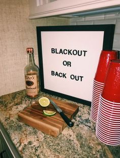 there is a sign that says blackout or back out on the counter next to some drinks