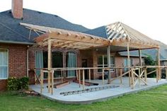 a house that is under construction in the grass