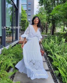 White Flowy Boho Dress For Beach Wedding, Flowy White Boho Dress For Beach Wedding, V-neck Boho Wedding Dress, White Floor-length Boho Dress For Vacation, White Floor-length Boho Dress For Beach, White Lace Trim Maxi Dress For Festivals, Elegant White Floor-length Boho Dress, White Flowy Floor-length Boho Dress, White Flowy Bohemian Maxi Dress