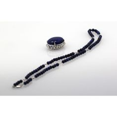 This is part of Chairish’s Fine Jewelry assortment.  LENGTH: 18″ chain, 22″ with pendant DIMENSIONS: Pendant is 30mm x 30mm STONES: Lapis lazuli beads, 4.5mm STONES: Diamonds, 2 ct surround, .8 ct accents, clarity SI1, color G, total 2.8 cts METAL: 18k white gold CONDITION: New  Lapis & Diamond Pendant 18K Beaded Lapis Chain. This extra fine quality lapis lazuli pendant is 25mm in a 30mm 2 carat diamond surround mount. Also, the 4.5mm lapis beads are strung on an 18k white gold chain, which is s White Gold Chain, Lapis Lazuli Pendant, Lapis Lazuli Beads, 2 Carat, Diamond Pendant, Lapis Lazuli, The 4, Gold Chain, Fine Jewelry