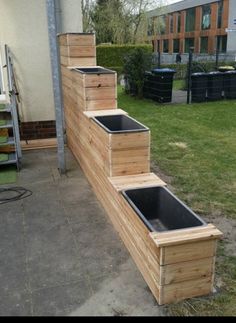 a set of stairs made out of wooden pallets on the side of a building