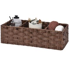 a wicker basket with soap, lotion and other items in it