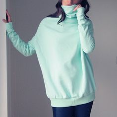 A thick sweatshirt with an original cut. Narrow at the back, wider at the front and rib at the bottom. Long sleeves. The name comes from the shape of the sweatshirt, which reminds Buka from the Moomin Valley. All edges sewn. One size is universal. Oversize. Soft blouse 95% cotton, 5% elastane. A soft nap from the left. One size, length (more or less from the shoulder): approx. 75 cm, armpit width: approx. 61 cm. Wash at low temperature, iron on the lowest program. Note: the product is made after Oversized Funnel Neck Top For Loungewear, Oversized Cotton Turtleneck Top, Oversized Cozy Turtleneck Top, Oversized Solid Funnel Neck Top, Oversized Funnel Neck Solid Top, Cozy Oversized Turtleneck Top, Solid Color Oversized Top With Funnel Neck, Oversized Cotton Funnel Neck Top, Oversized Turtleneck Tops With Ribbed Cuffs