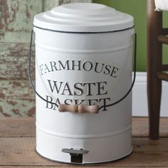 a large white bucket with a wooden handle